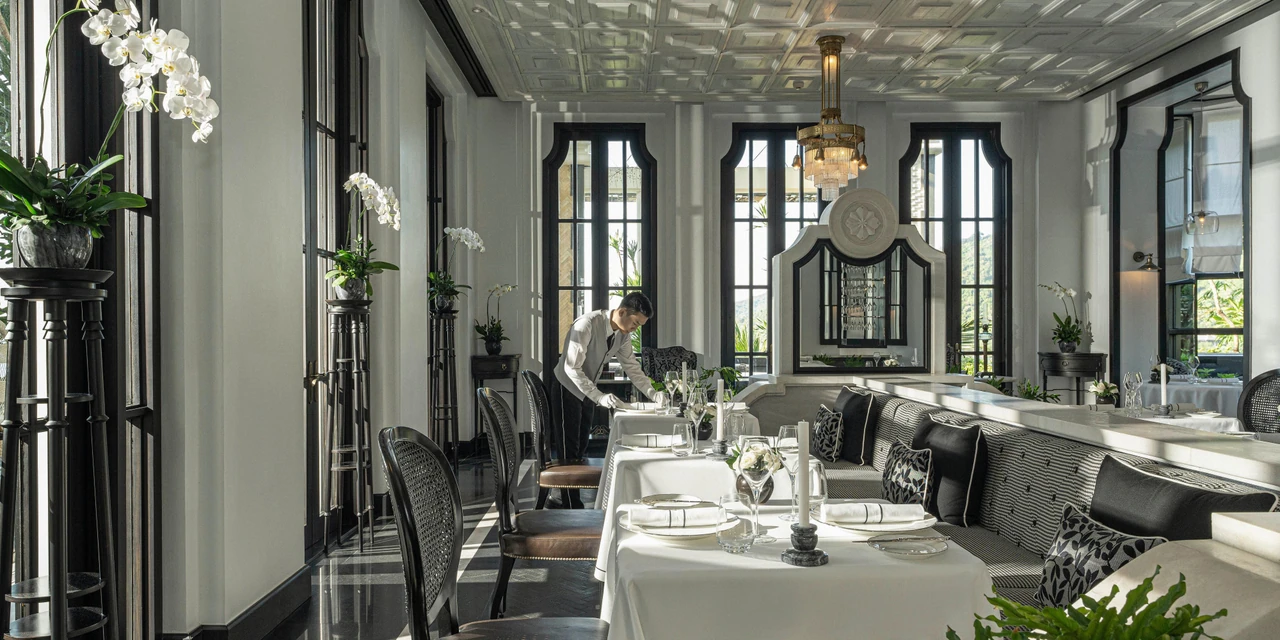 La Maison 1888’s black-and-white restaurant interiors, window frames and formal dining tables