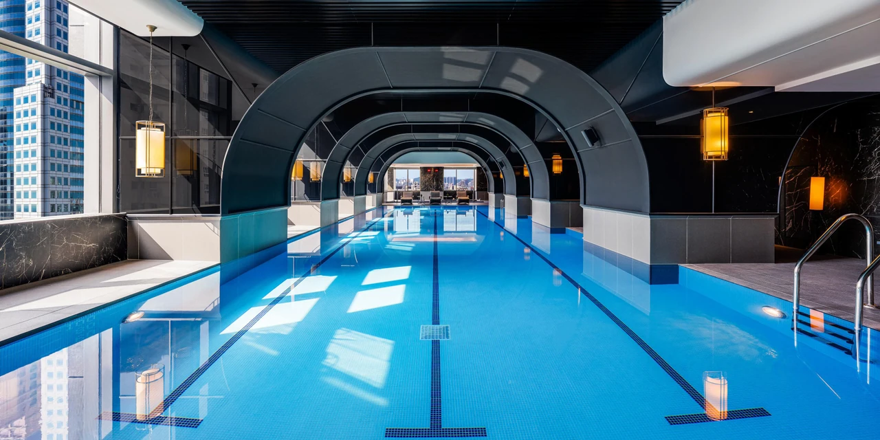 The indoor pool at InterContinental Kaohsiung, with arched frames and daylight reflected on the water
