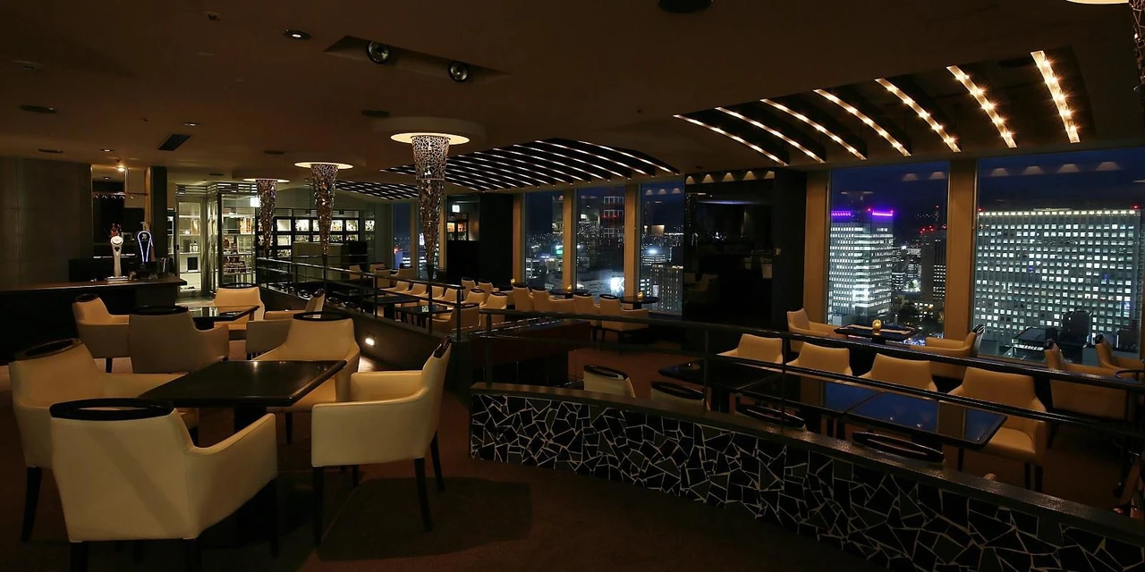Seating, the bar and city lights at ANA Crowne Plaza Sapporo’s Sky Lounge Sapporo View
