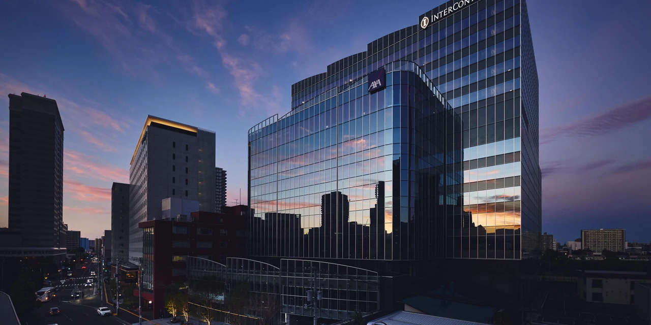 The modern glass facade of InterContinental Sapporo and the city skyline
