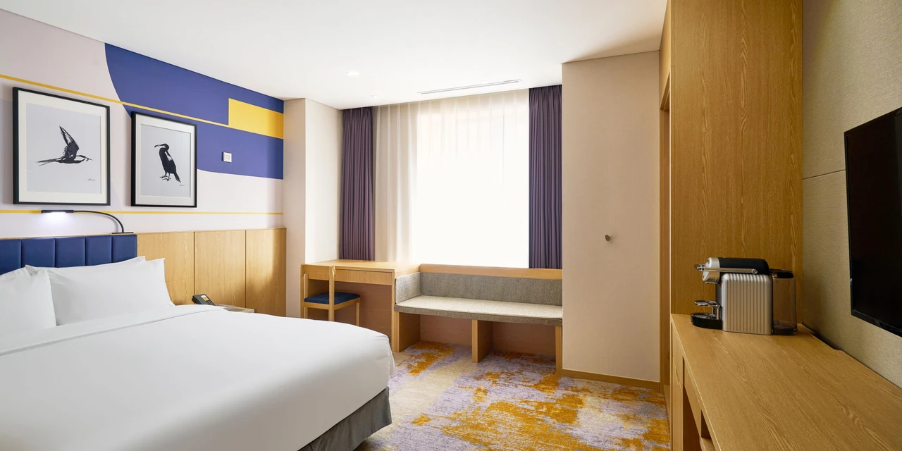 voco Seoul Myeongdong · The hotel’s guest-room living and sleeping spaces