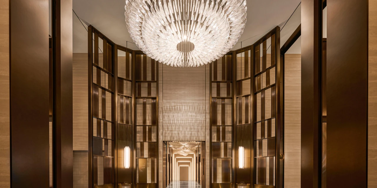 Crystal chandelier and gold-toned frames in InterContinental Taichung’s high-ceilinged lobby