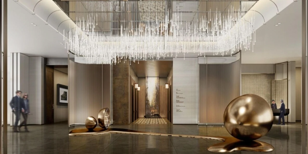 Official architectural visualisation of the Taipei hotel lobby with suspended lights, golden spheres and stone finishes